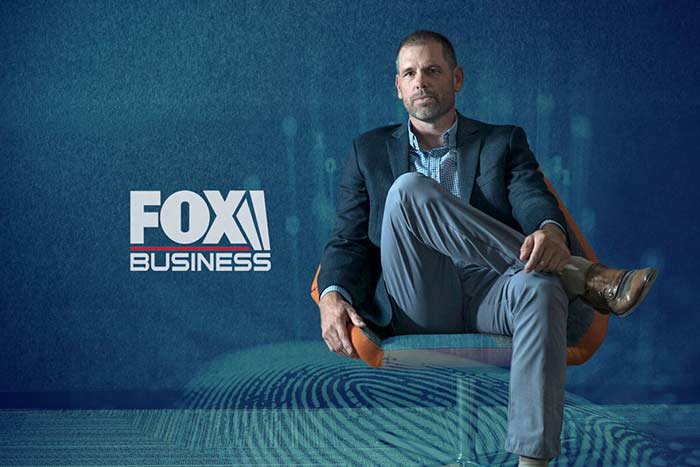 gloved hand holding Social Security card